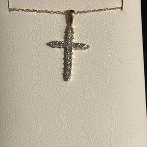 10 k gold Cross with diamonds sold with chain 20 inches